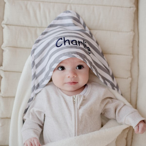 baby wearing grey stripe hooded bath towel newborn gift personalise with baby name embroidery