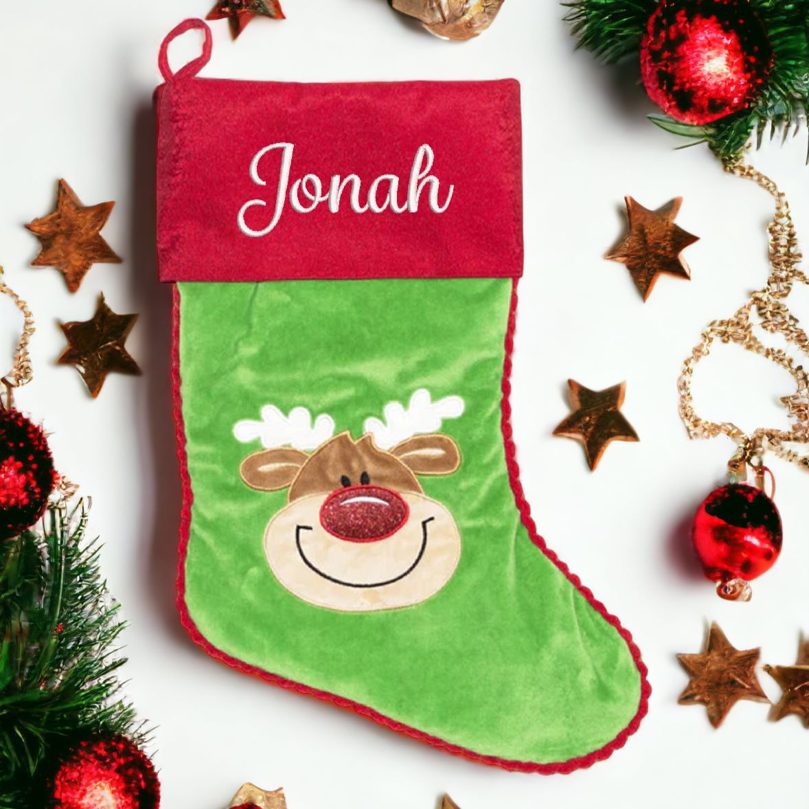 Green Christmas stocking with embroidered reindeer personalised with name