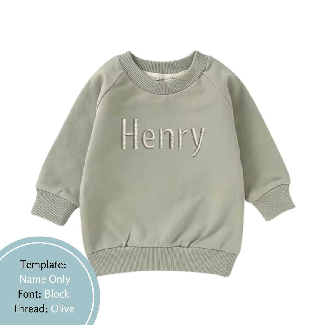 khaki green baby and toddler crewneck jumper emrboidered with a name using an olive green thread