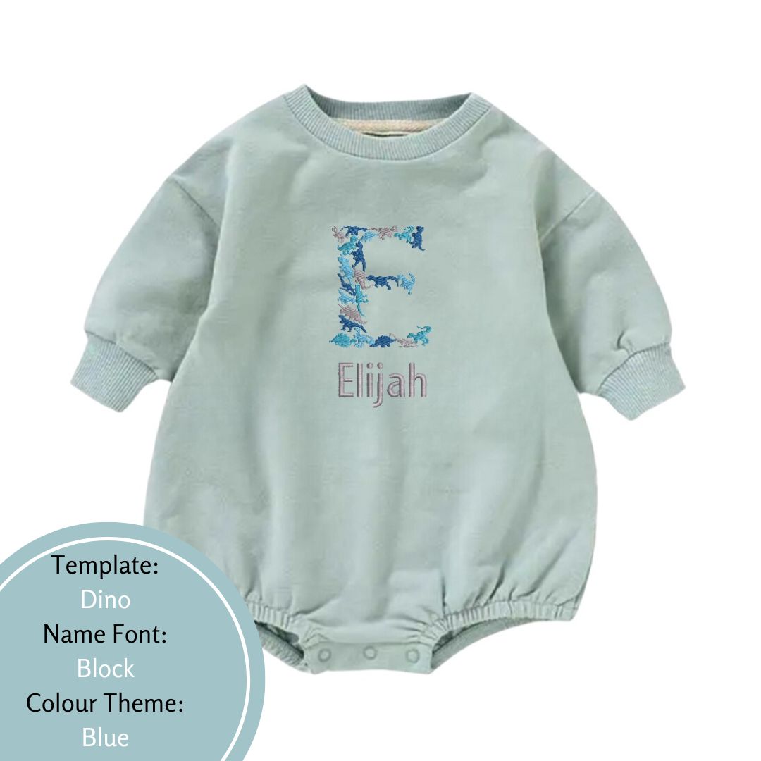 pale mint bubble romper embroidered with a dino name design in a blue colour theme