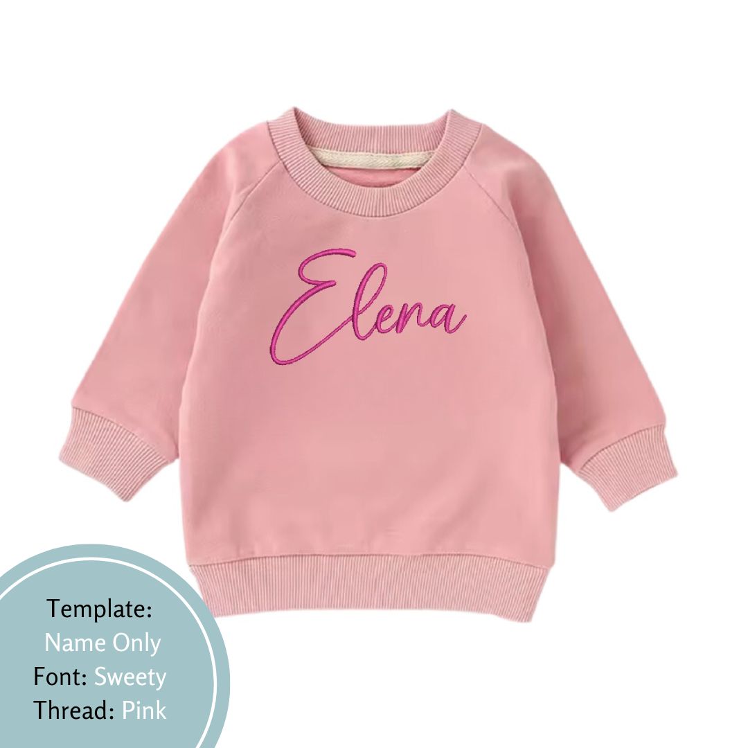 pink baby and toddler crewneck jumper embroidered with a name in pink thread colour