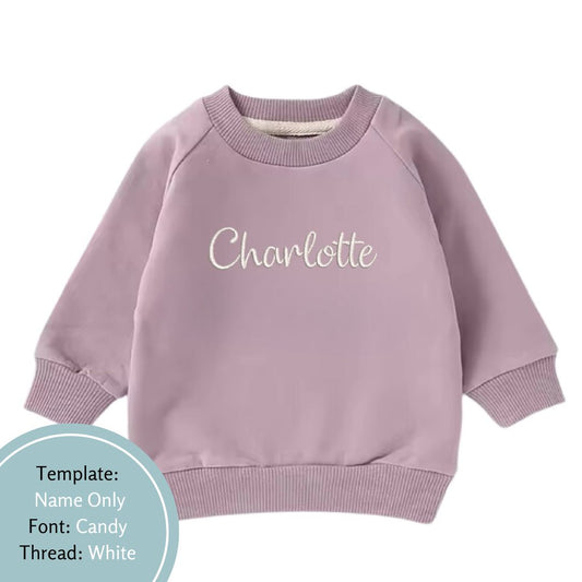 purple baby and toddler crewneck jumper personalised with a name embroidered in white thread